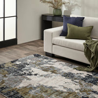 Living room with a patterned rug, beige sofa, and decorative pillows.