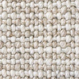 Close-up of a woven beige and white fabric texture