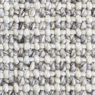 Close-up of a textured beige and brown woven pattern