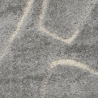 Close-up of textured gray carpet with geometric pattern