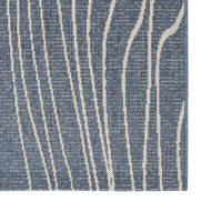 Close-up of a blue and white striped rug