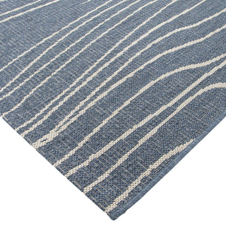 Blue and white striped rug on a white background