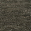 Close-up of a textured brown fabric surface