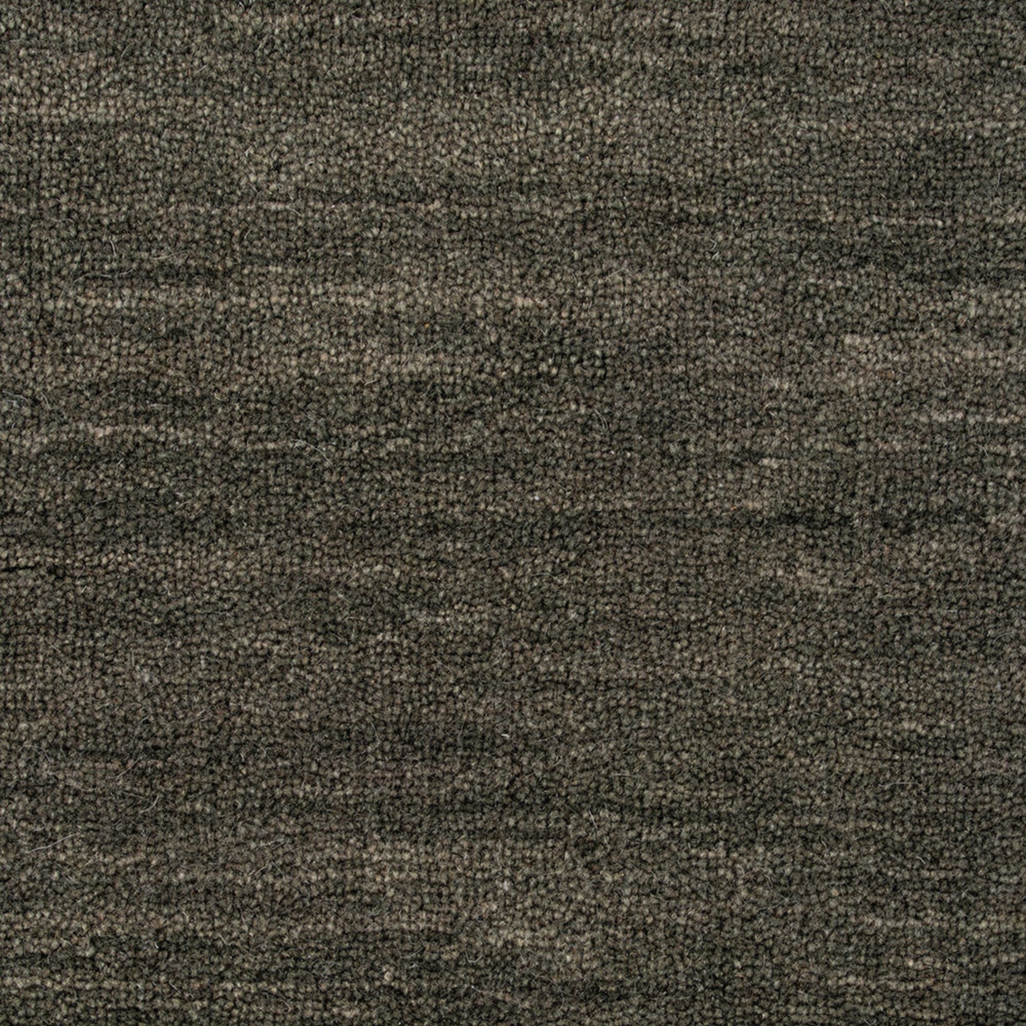 Close-up of a textured brown fabric surface
