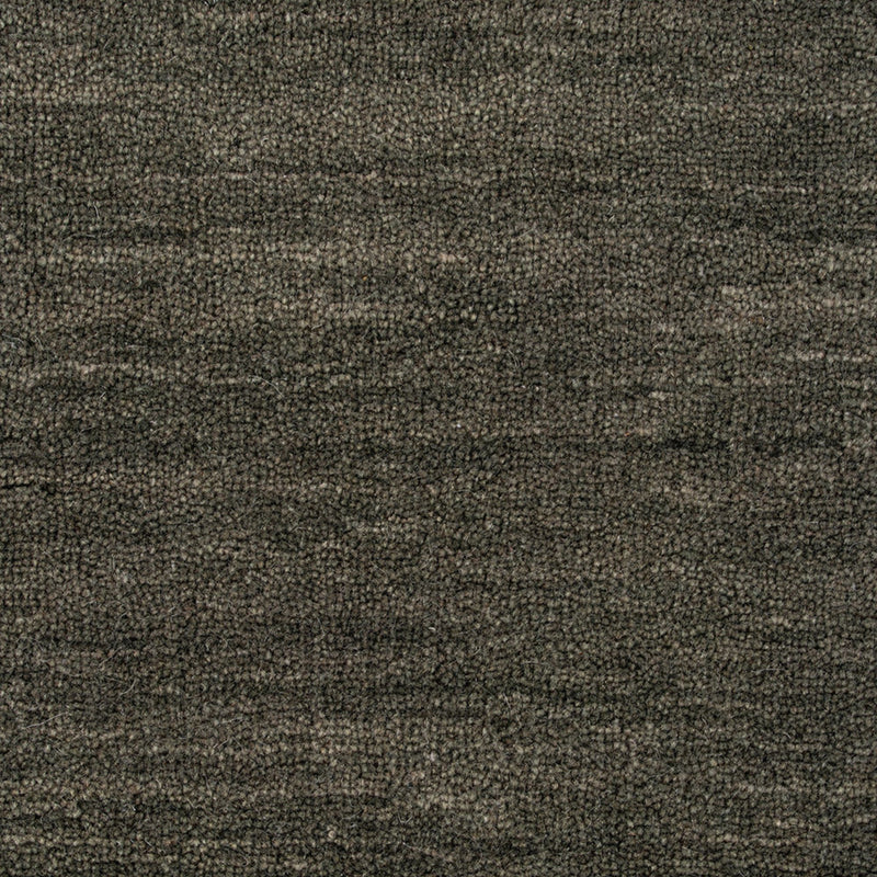 Close-up of a textured brown fabric surface