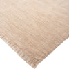 Beige rug with fringes on a white background