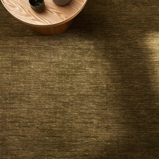 Brown textured surface with a wooden table corner in the top left corner.