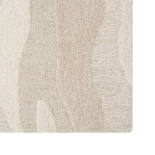 Close-up of a textured beige rug with a subtle pattern