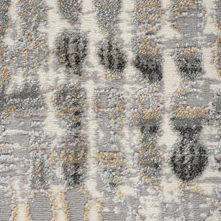 Textured patterned rug with gray, black, and beige colors