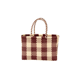 Woven handbag with brown and beige checkered pattern on a white background