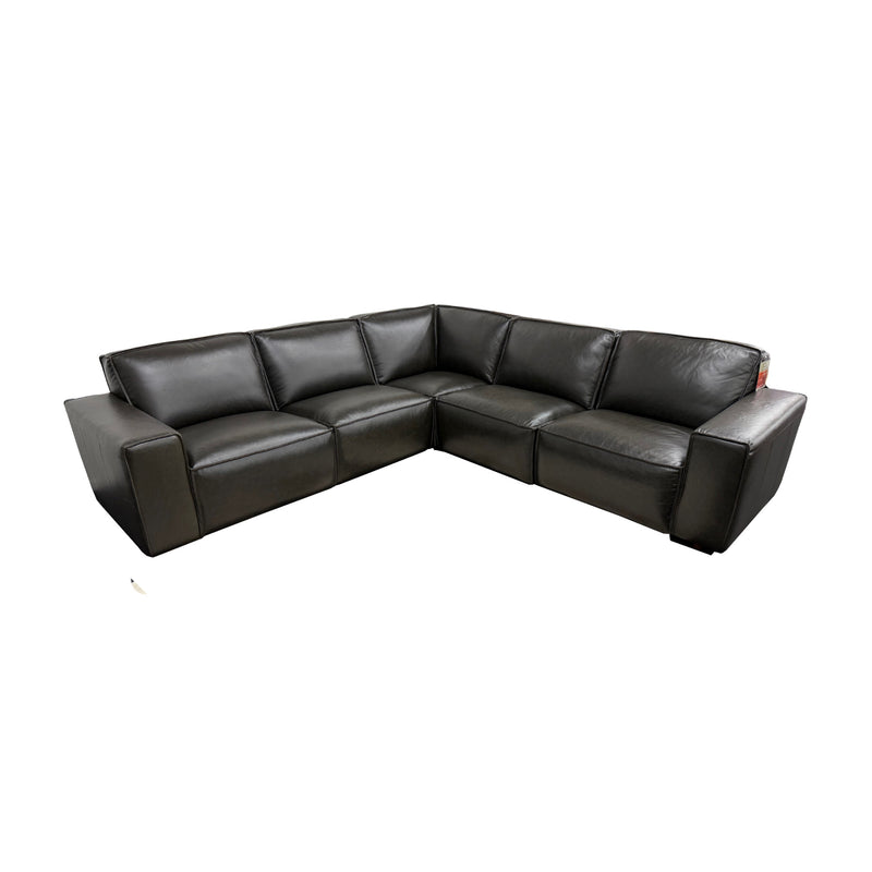 Black leather sectional sofa on a white background