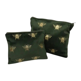 Two green pouches with bee patterns on a white background