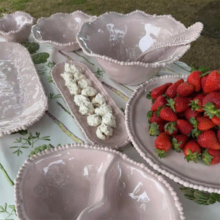 French Pink melamine pearl double bowl styled on outdoor table with matching serveware