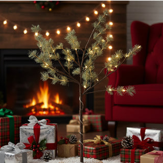 Decorative Christmas tree with lights in a festive living room with presents and a fireplace.