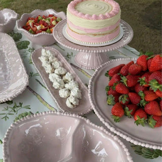 French Pink melamine pearl cake stand styled with matching serveware on outdoor table
