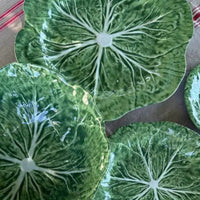 Large 40cm cabbage leaf melamine round platter with appetisers on dining table