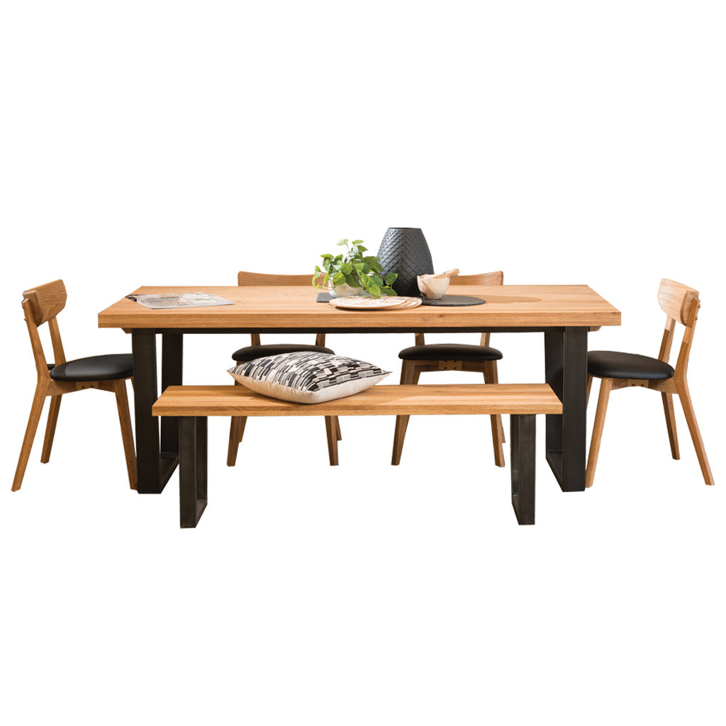 Calia table paired with Calia bench seat and Pisa dining chairs